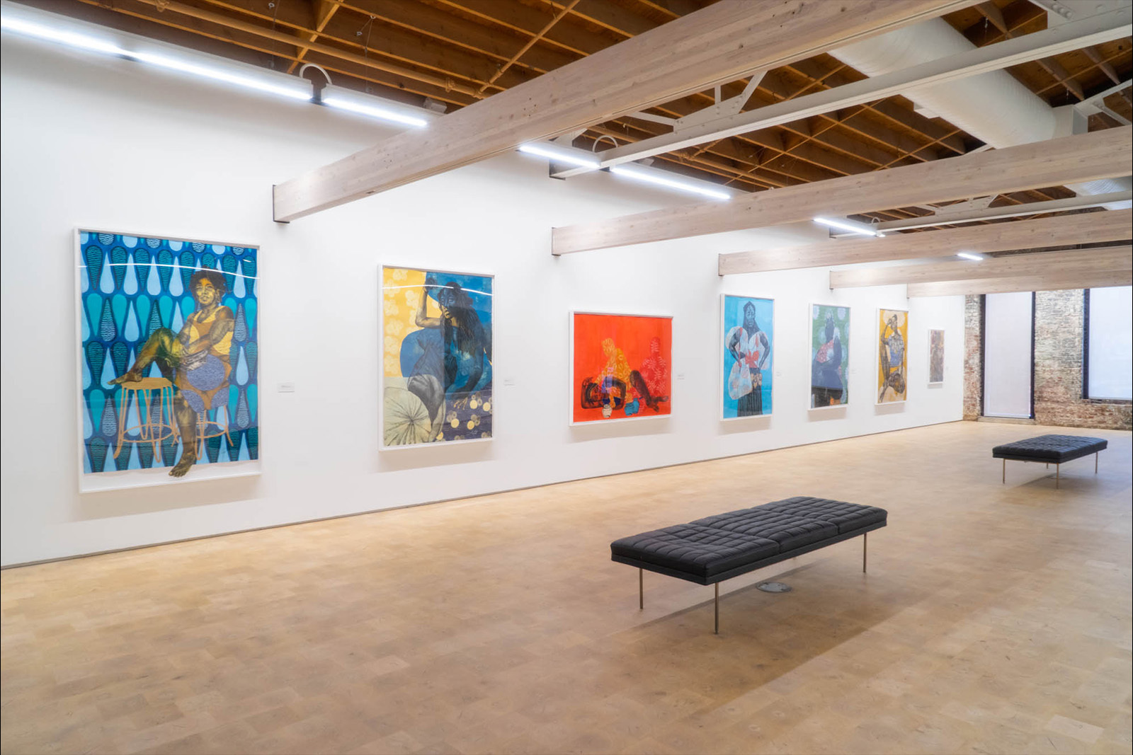 7 works by Delita Martin hang on the wall of the The Wanda D Ewing Gallery