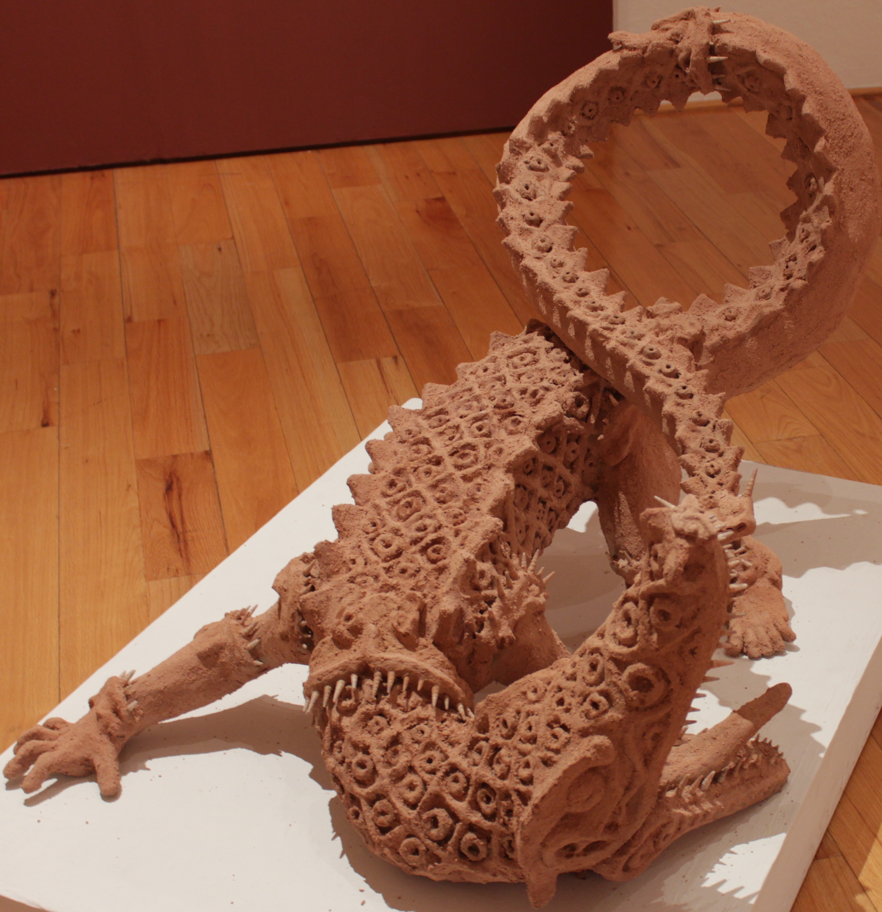 A Sculpture Of A Cipactli Eating Its Own Tail