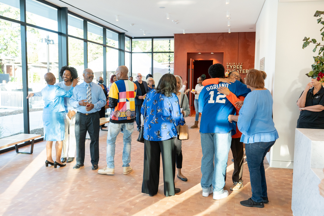 A crowd gathers in the lobby of the Shirley Tyree Theater during the theater dedication event