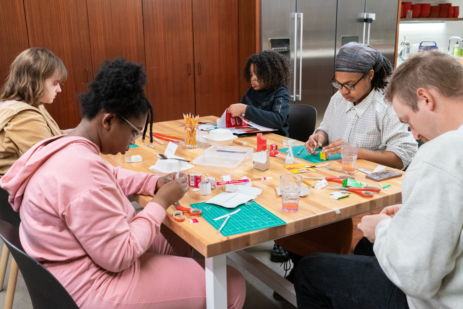 Action Brigade artists work on models for a community art pantry