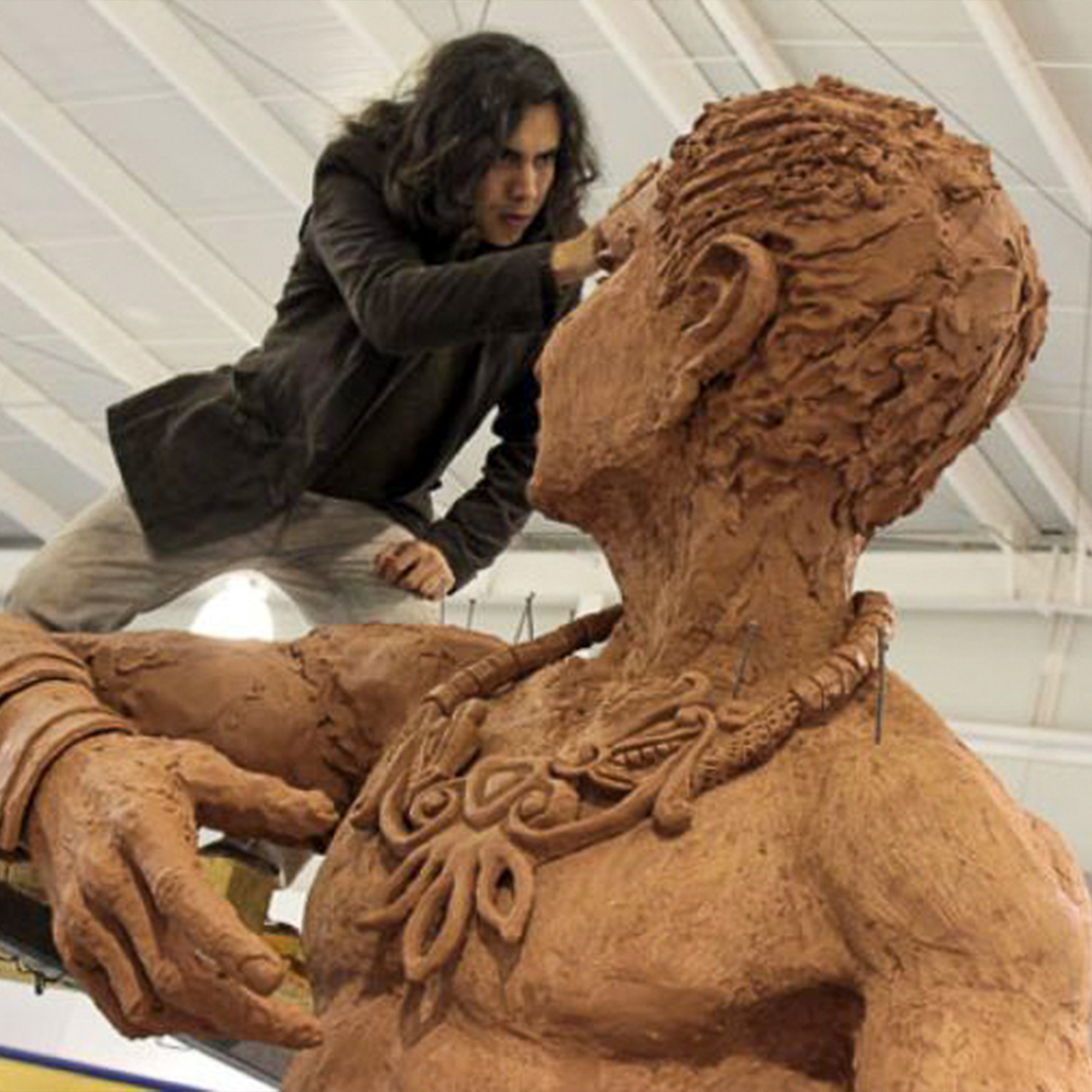 Artist David Manzanares Works On The Head Of A Large Figure Sculpture Square