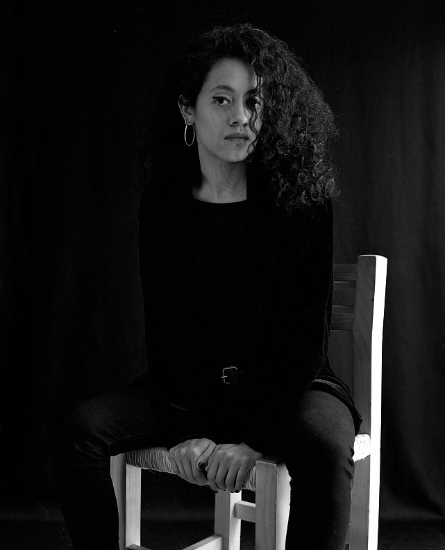 Black And White Portrait Of Enero y Abril Sitting The Background Is Black