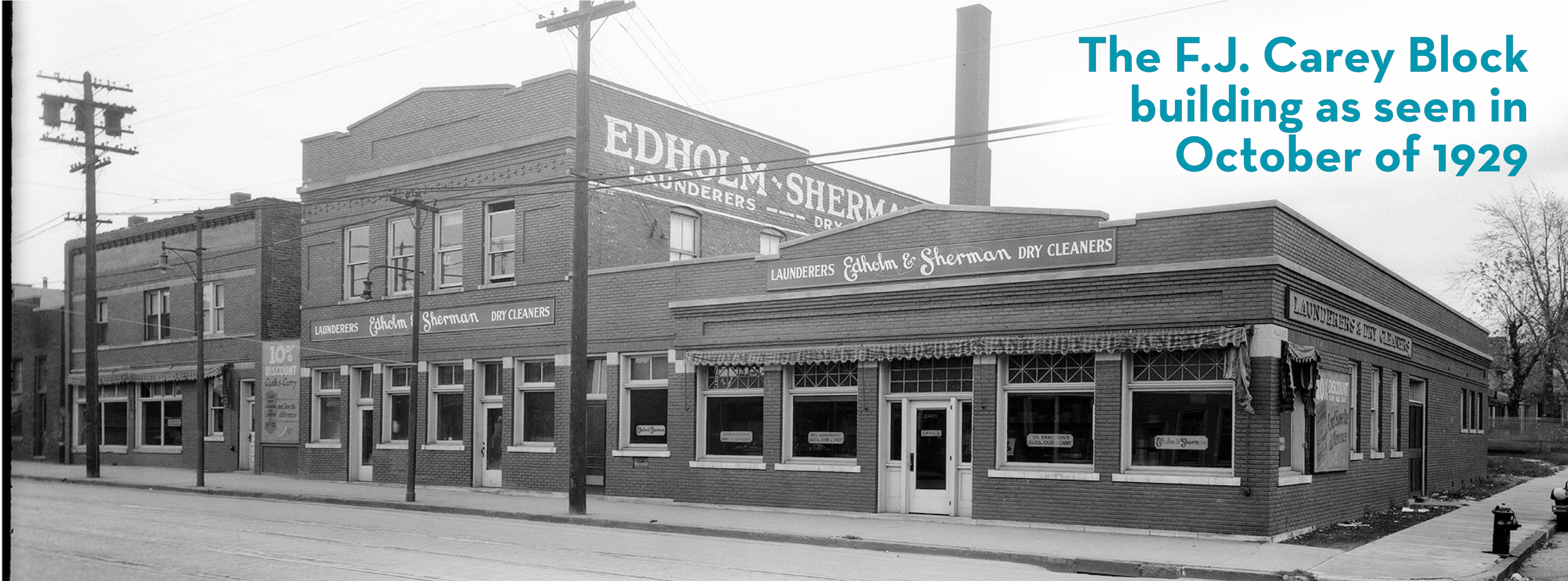 Black and white archive photo of FJ Carey Block building Text overlay reads FJ Carey Block building October 1929