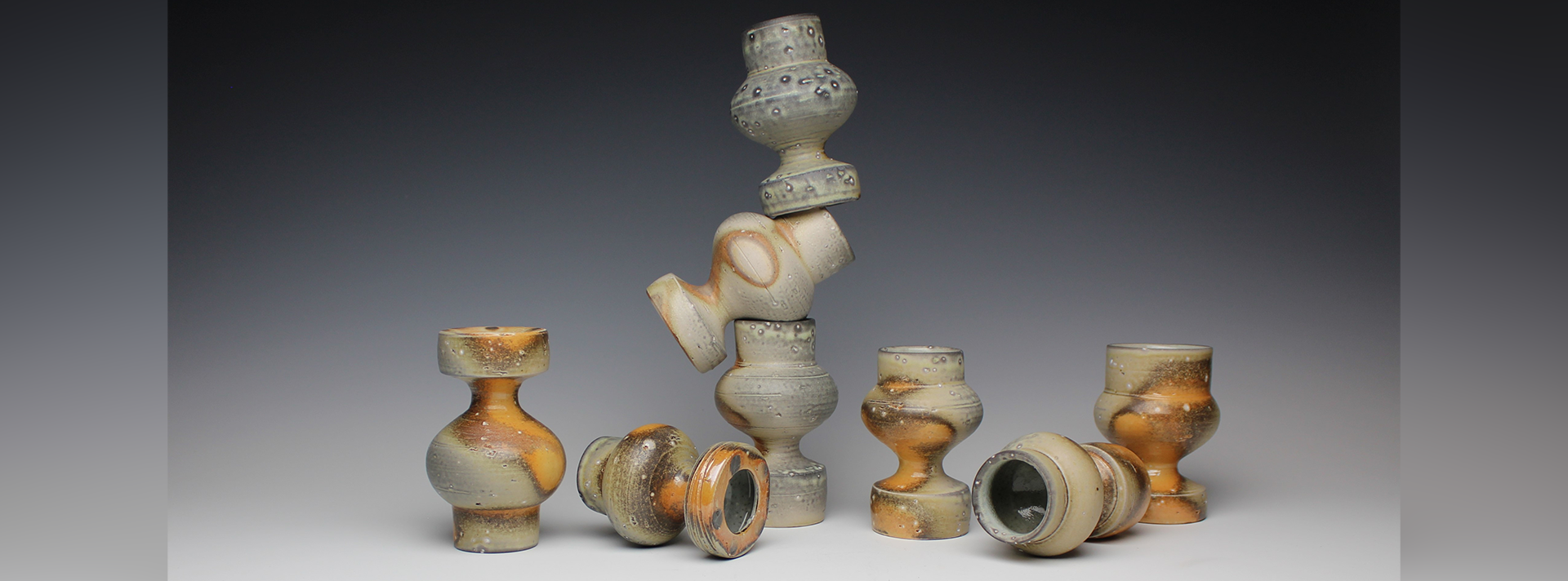 Casey Beck full width header ceramic works on a white to black gradient background