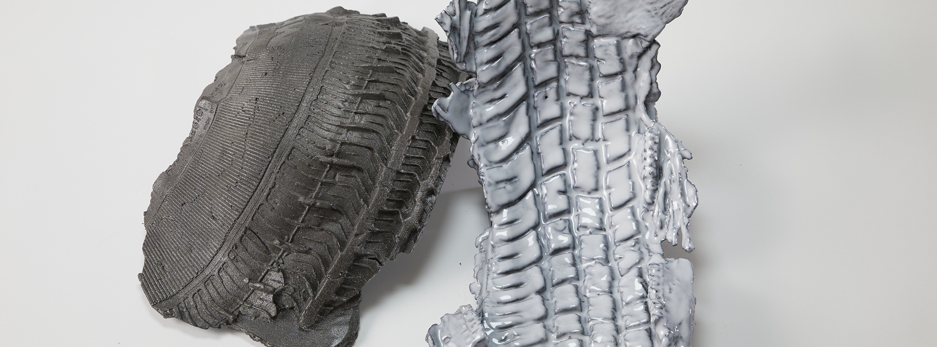 Header Lee Emma Running Project two slices of tire tread on a white background the right one has a thick white paste on it jpg