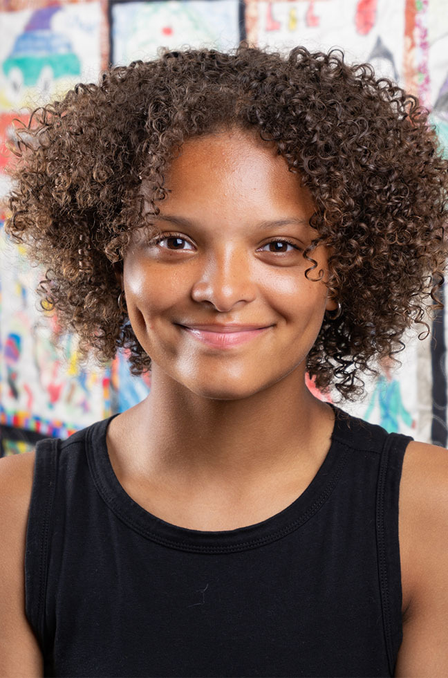Portrait photo of young artist mentor Corinne
