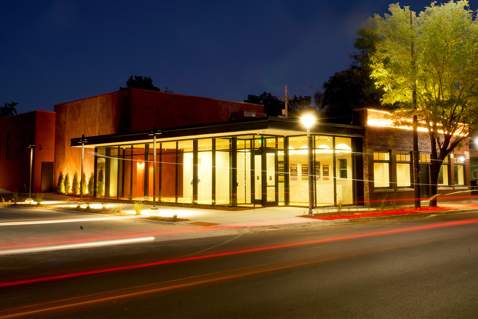 The Shirley Tyree Theater seen at night A large glass entryway is framed by a red brick building