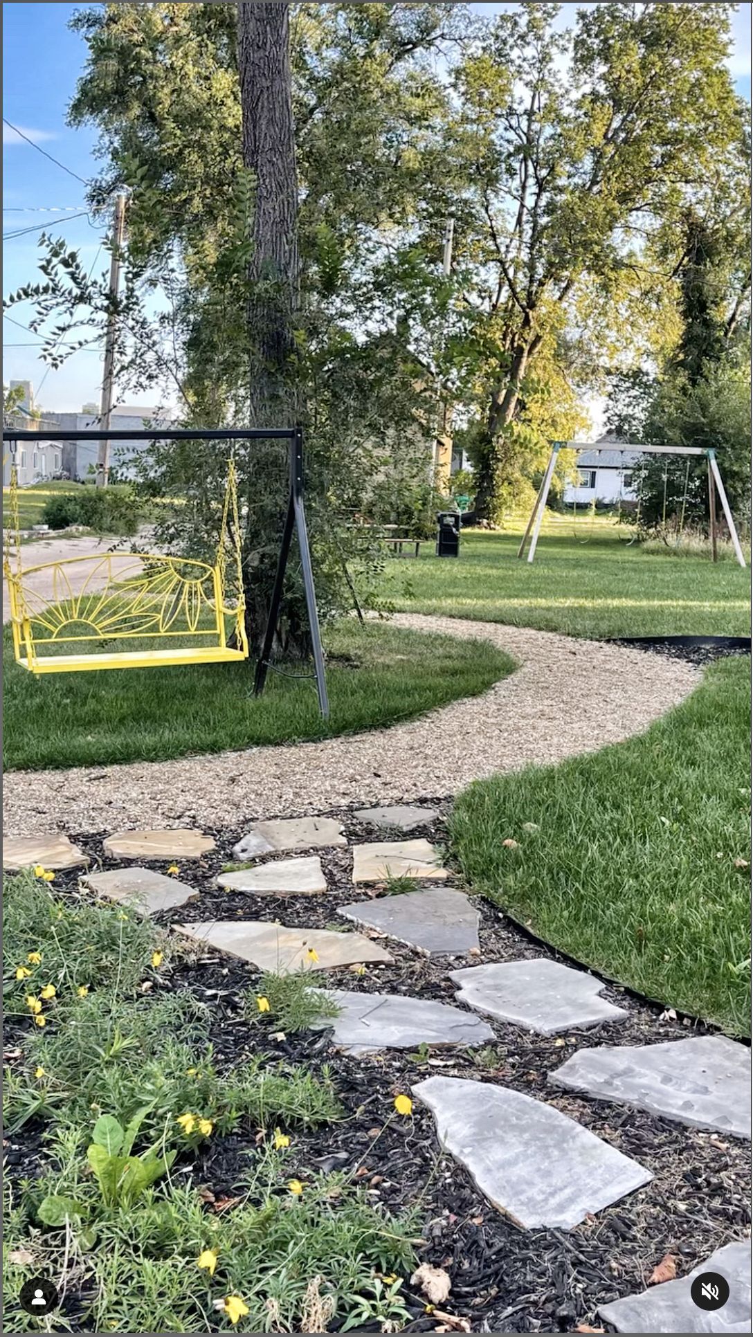 Tierra park with a coblestone trail and yellow bench swing